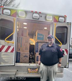 Chief Welch delivering toys to Anchored Ministries